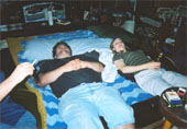 Playing darts is hard work. Colin and Cathy relax on the waterbed. Awww.