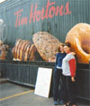 Aderyn and AJ outside a 'Tim Hortons'